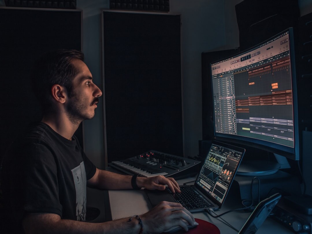Sound engineer at a professional audio mixing board
